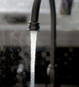 Water pouring from faucet